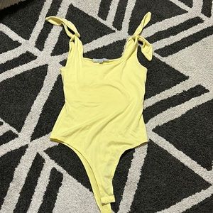 Yellow body suit